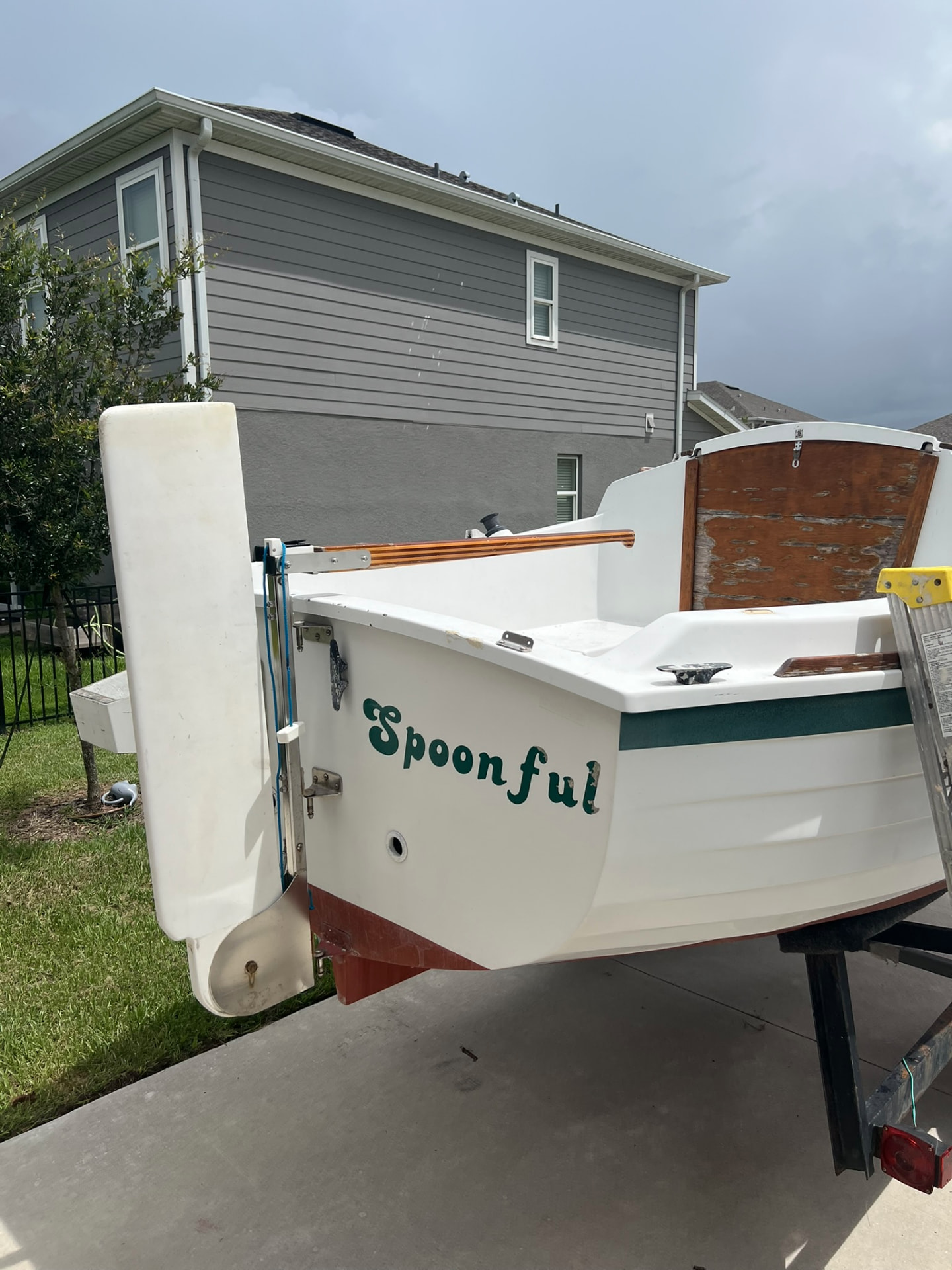 Stern view showing rudder, tiller and Spoonful's transom name