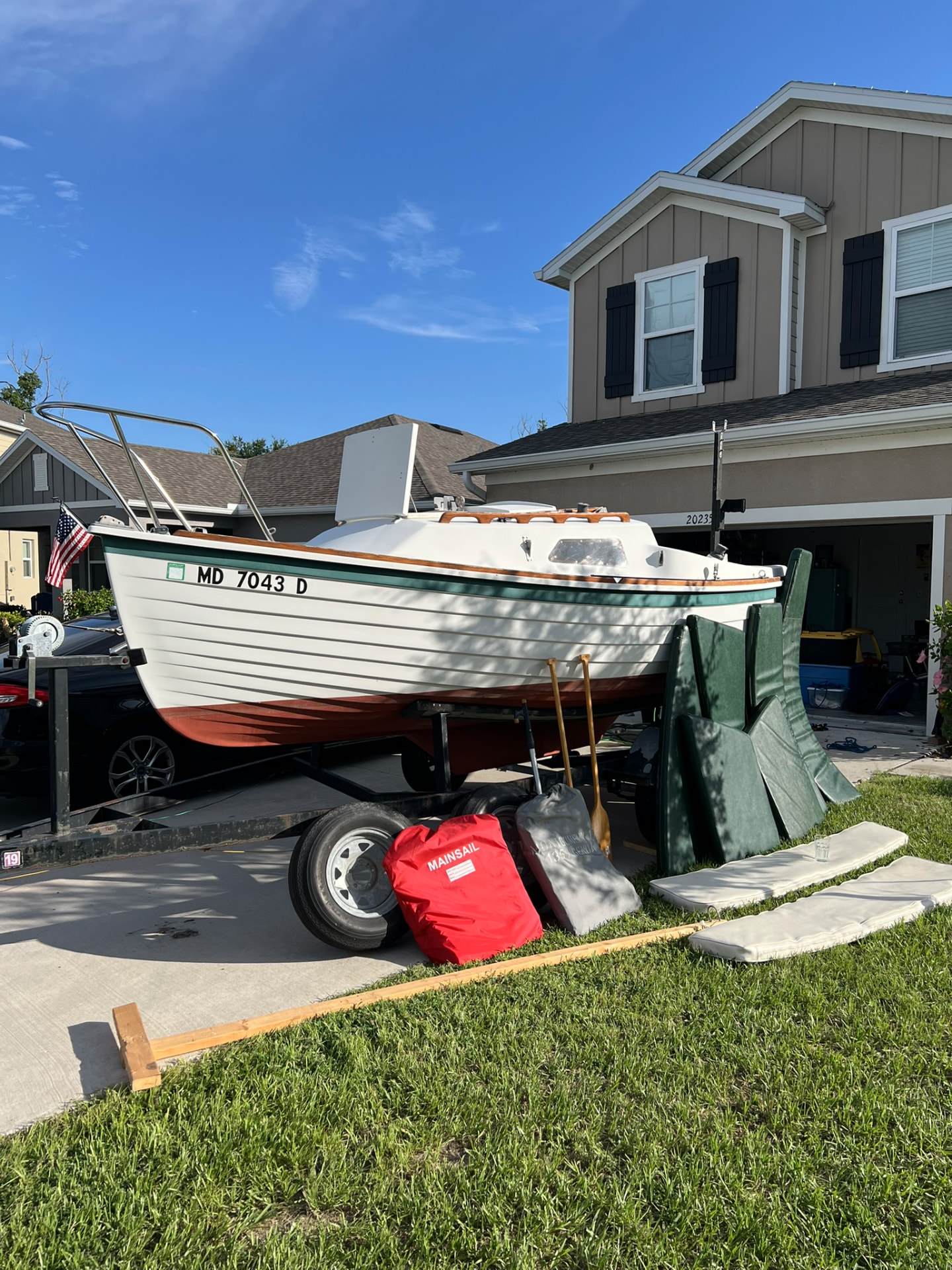 Spoonful on her trailer, port bow view with included gear laid out
