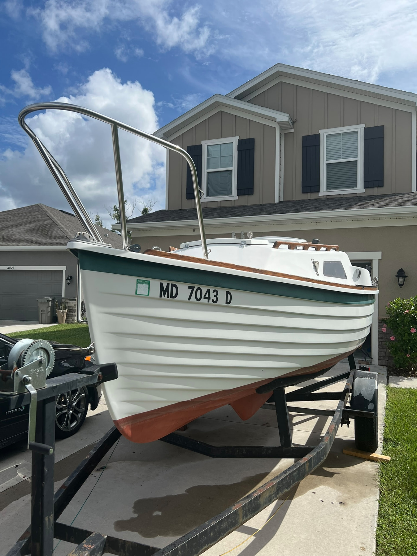 Bow view of Spoonful showing lapstrake hull, bootstripe and bow rail