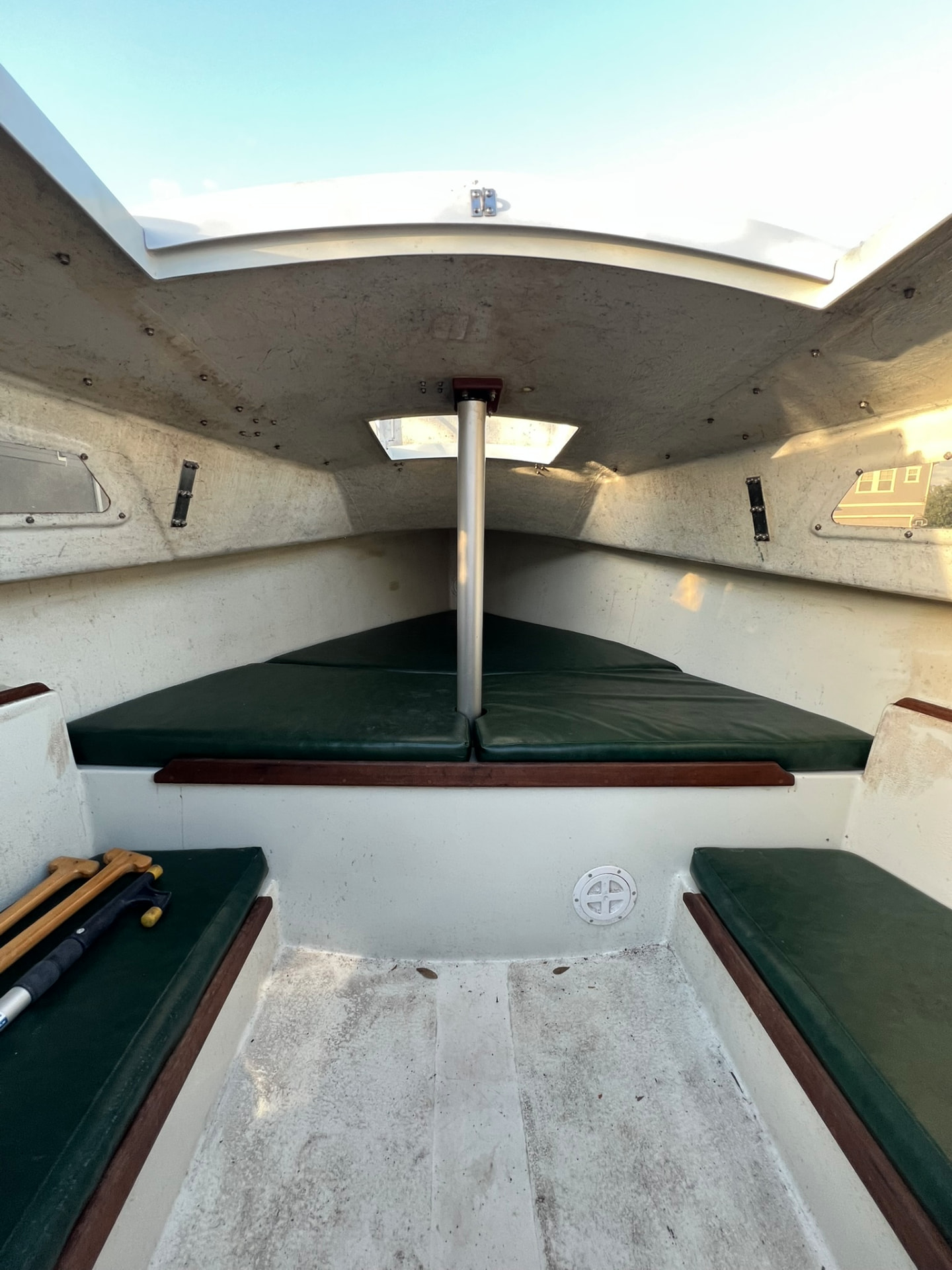 Cabin interior showing V-berth, compression post and settee cushions