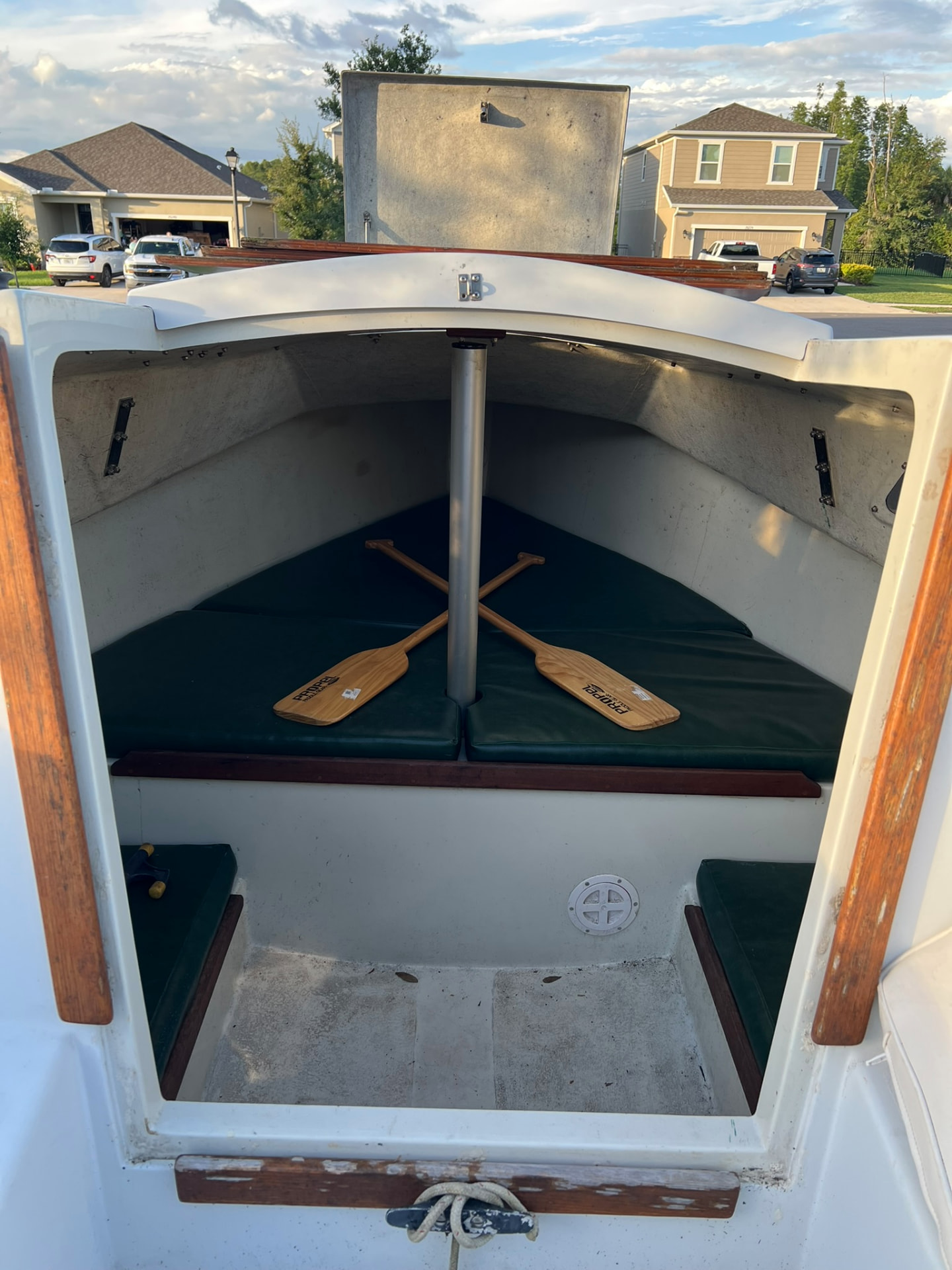 Looking into the cabin through the companionway with oars on the berth