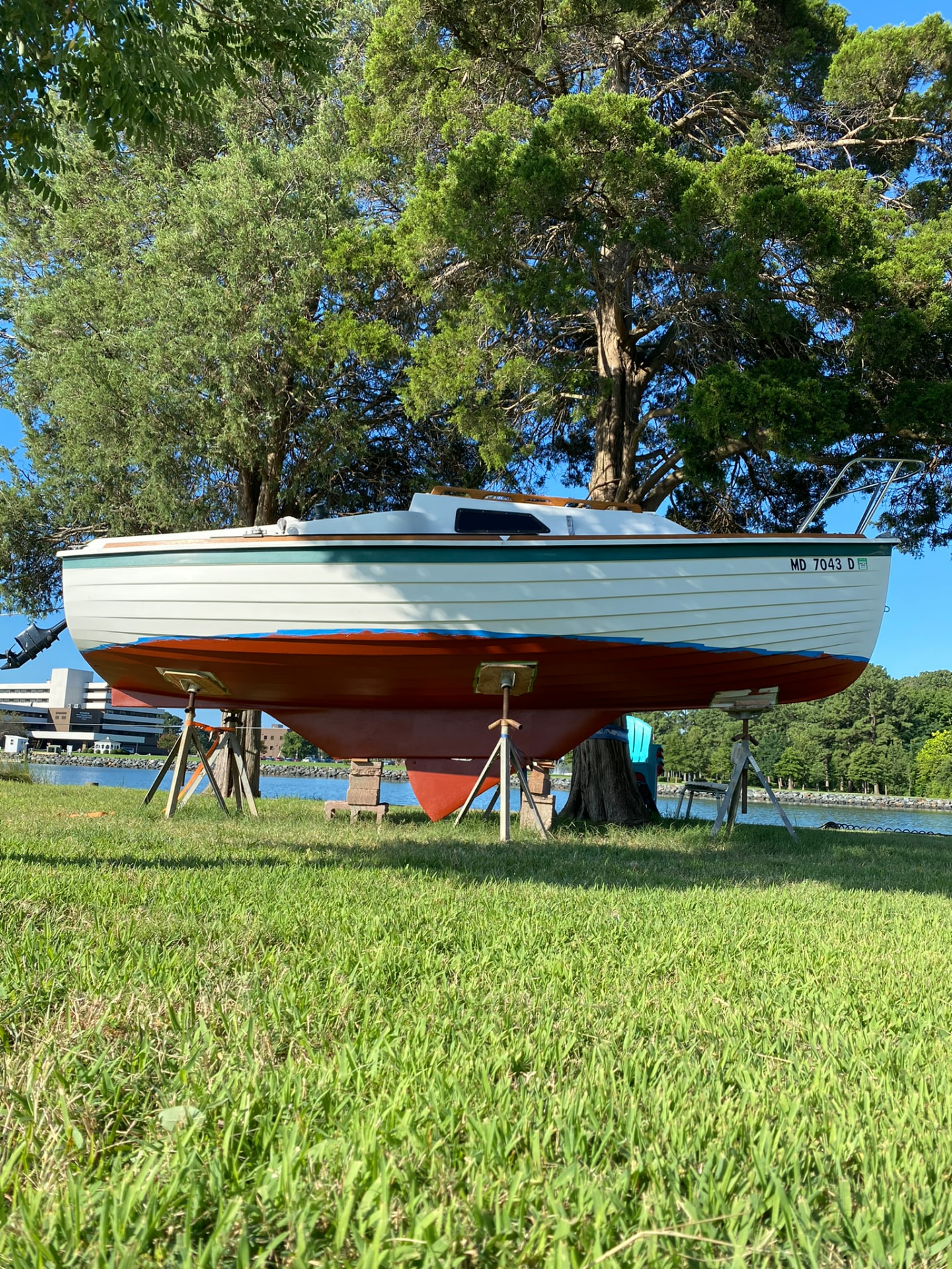 Freshly painted red bottom paint with the boat on stands